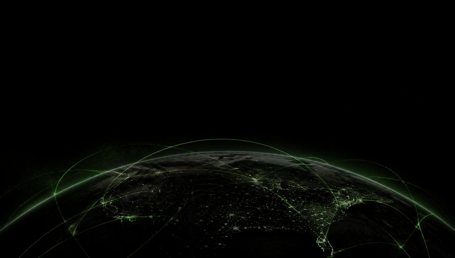 Earth at night encircled by green data routes